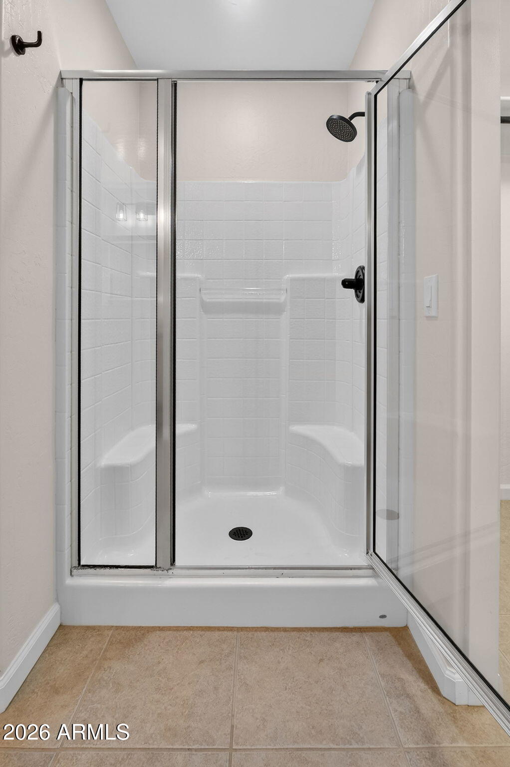 1815 South 174th Avenue Goodyear, AZ 85338 - Photo 37 of 57 a bathroom with a glass shower door
