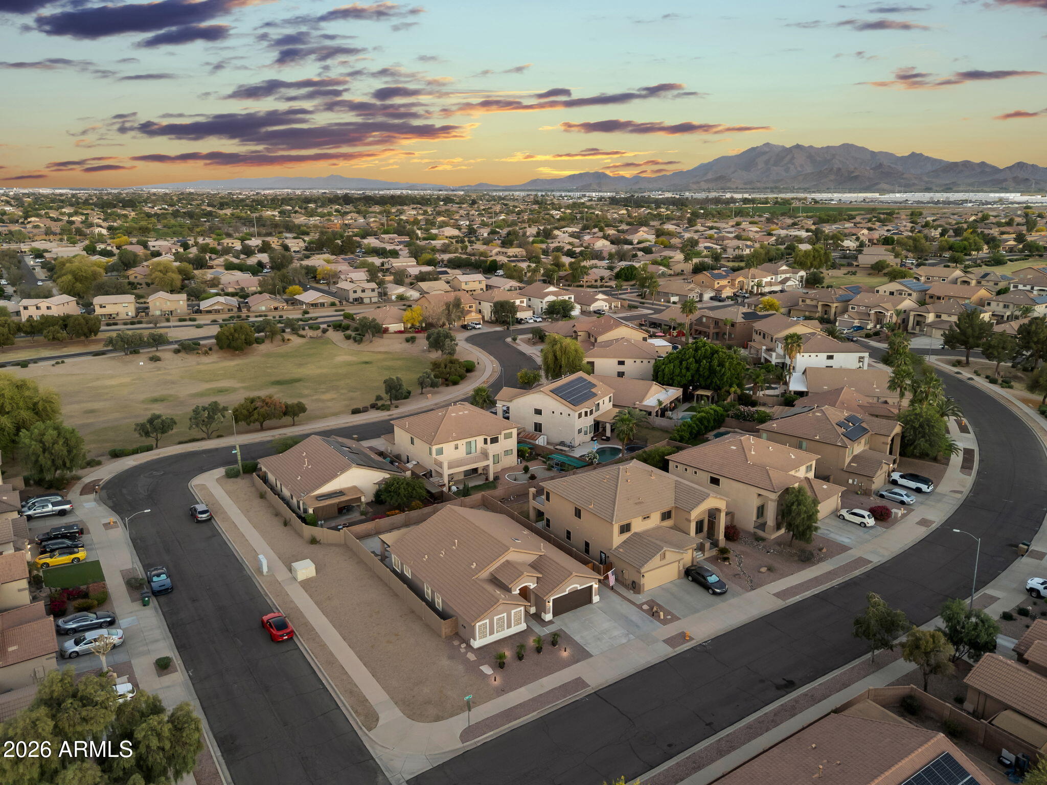 1815 South 174th Avenue Goodyear, AZ 85338 - Photo 3 of 57 an aerial view of a house with a lake