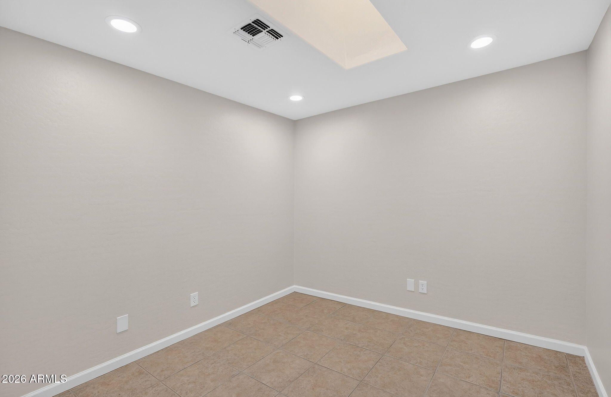 1815 South 174th Avenue Goodyear, AZ 85338 - Photo 43 of 57 an empty room with a workbench