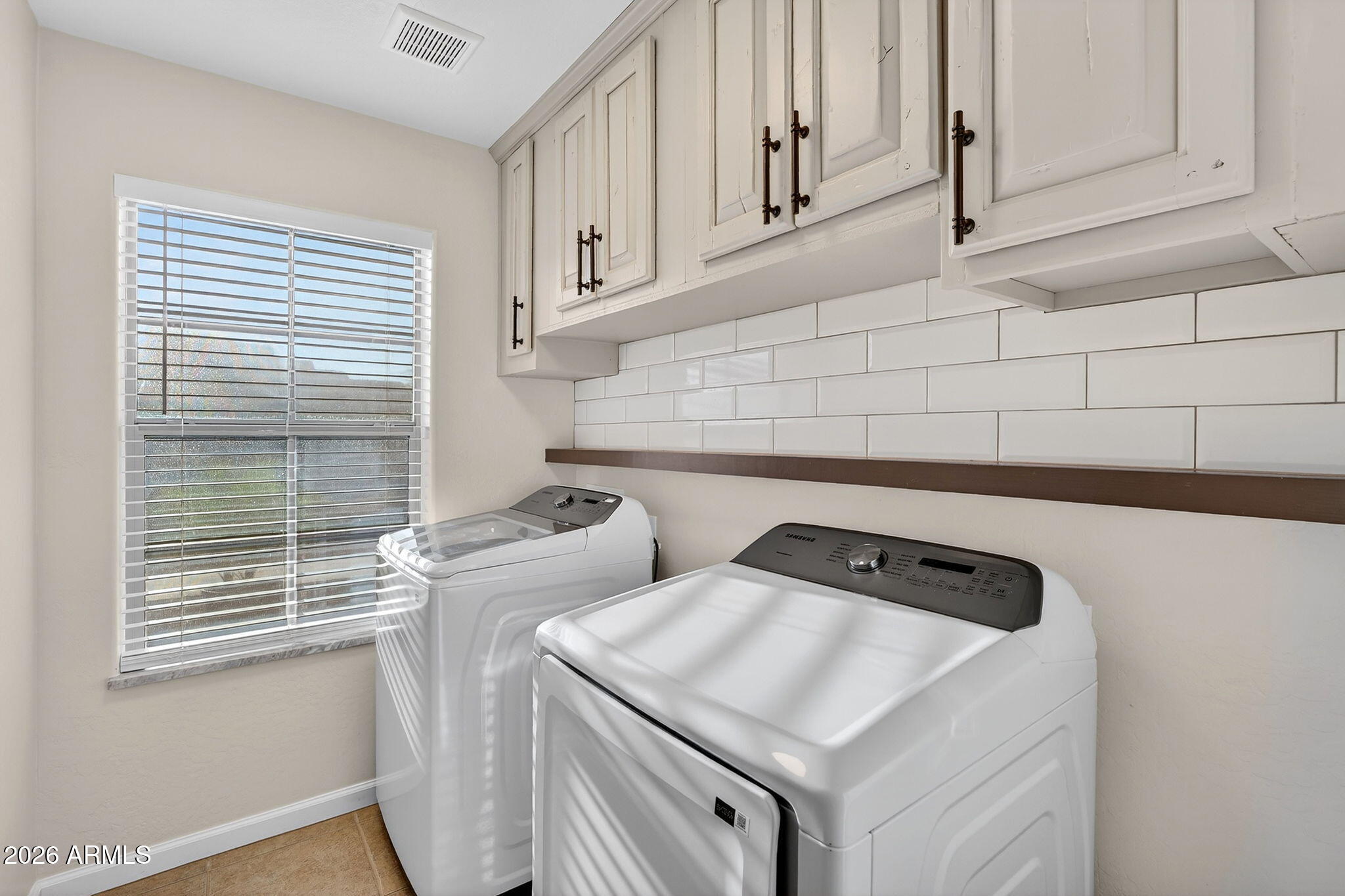 1815 South 174th Avenue Goodyear, AZ 85338 - Photo 45 of 57 a utility room with dryer and washer