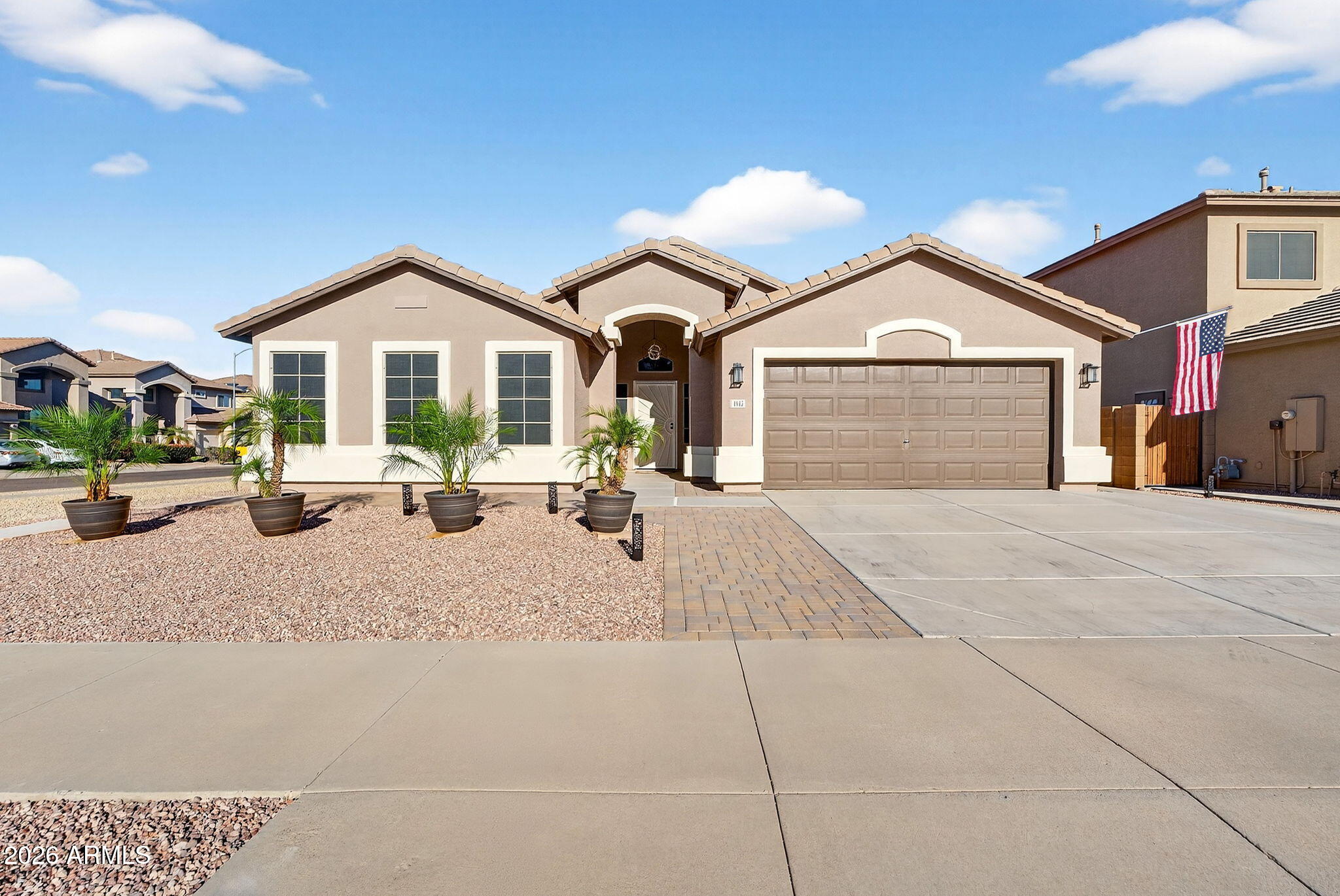 1815 South 174th Avenue Goodyear, AZ 85338 - Photo 54 of 57 a front view of a house with a yard