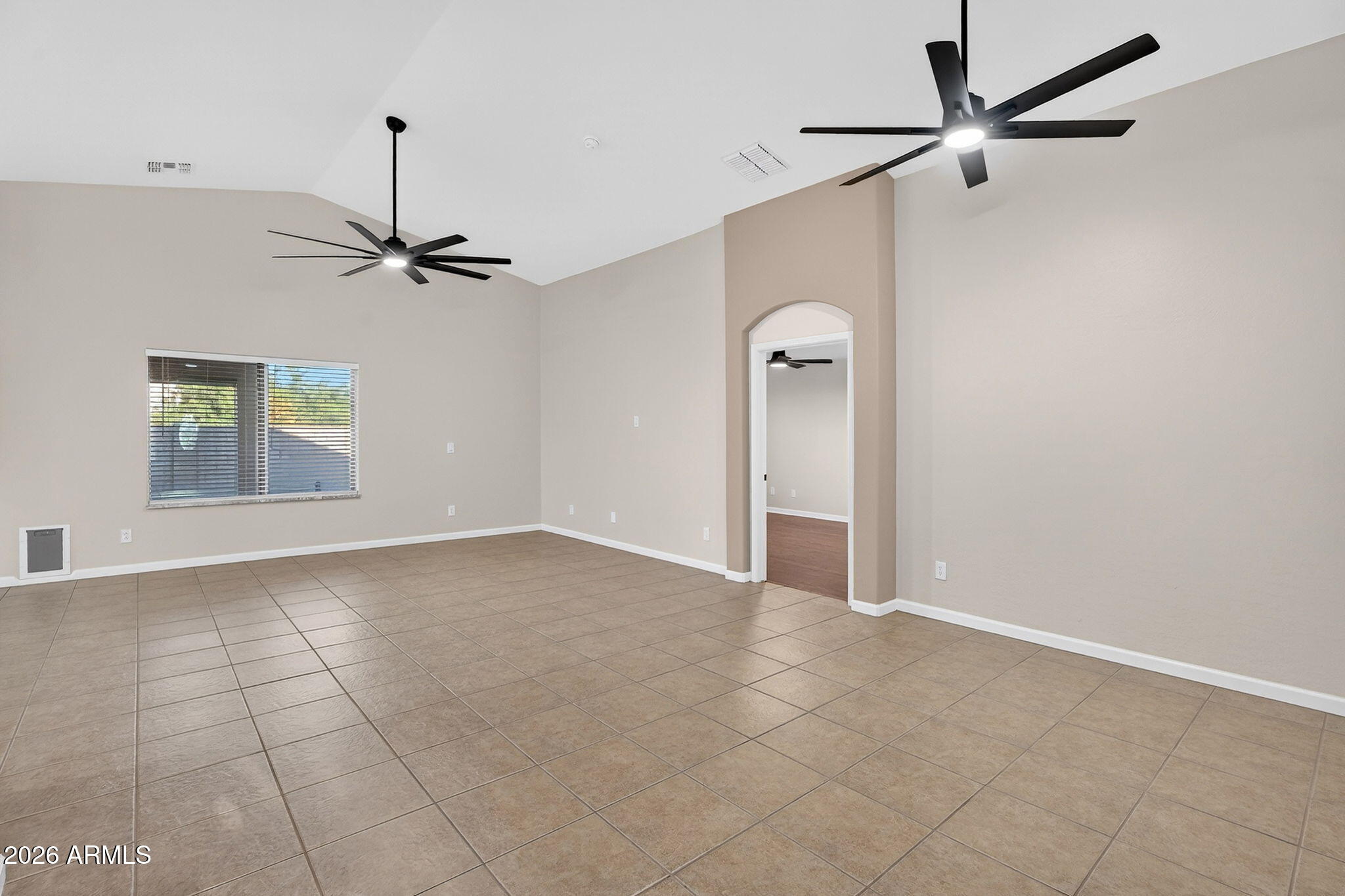 1815 South 174th Avenue Goodyear, AZ 85338 - Photo 9 of 57 a view of an empty room with a window