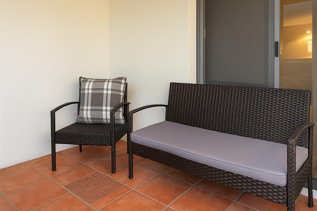 6161 Northwest 2nd Avenue, Unit 121 Boca Raton, FL 33487 - Photo 17 of 20 a view of a bench in a balcony