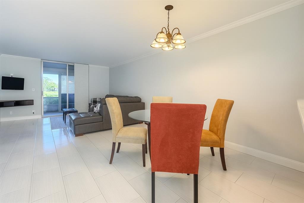 6161 Northwest 2nd Avenue, Unit 121 Boca Raton, FL 33487 - Photo 3 of 20 a view of a dining room with furniture