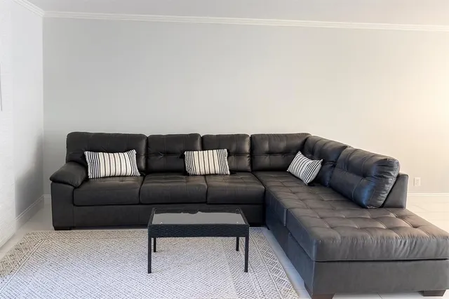 a living room with furniture and a couch