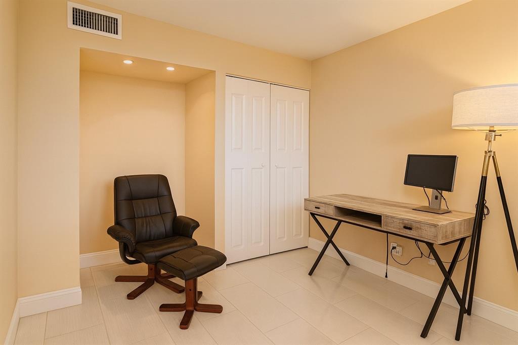 6161 Northwest 2nd Avenue, Unit 121 Boca Raton, FL 33487 - Photo 10 of 20 a view of a workspace with furniture and a window