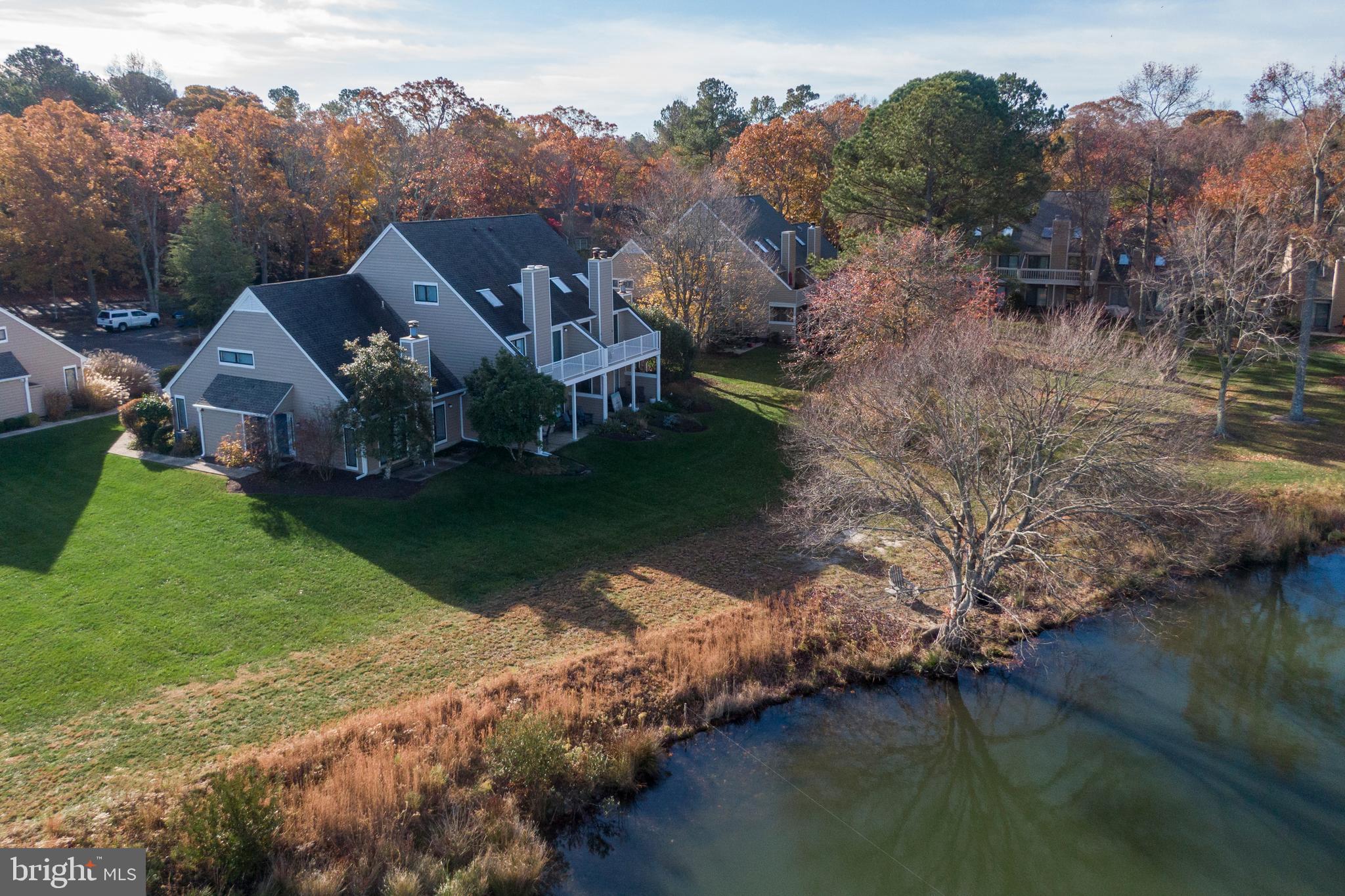 20852 Spring Lake Drive, Unit 405 Rehoboth Beach, DE 19971 - Photo 38 of 45 an aerial view of a house with a yard