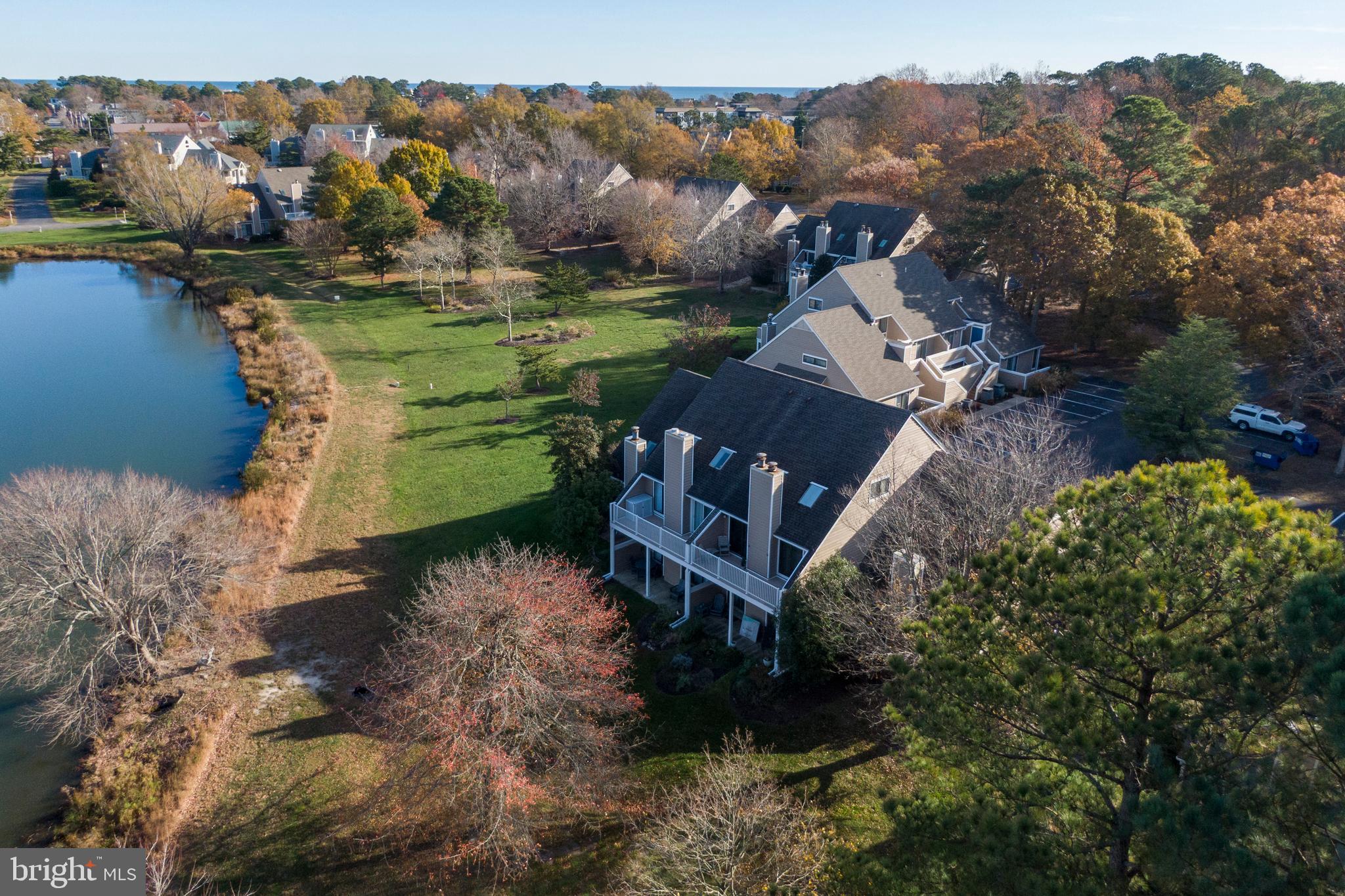 20852 Spring Lake Drive, Unit 405 Rehoboth Beach, DE 19971 - Photo 40 of 45 a view of a house with a yard