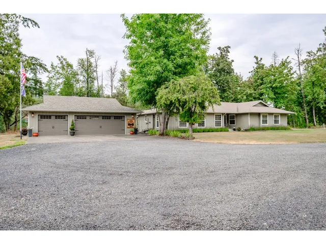 a view of house with outdoor space and sitting area
