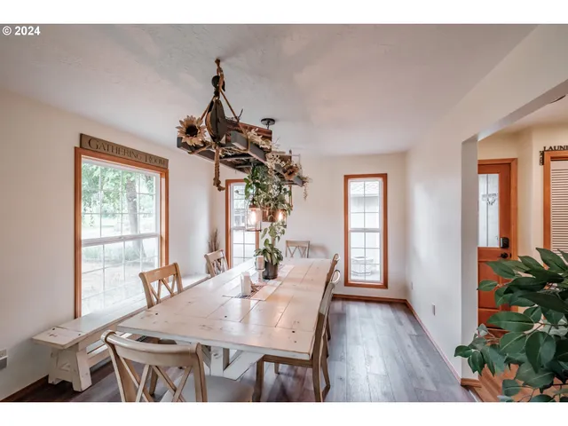 a view of a dining room with furniture window and wooden floor