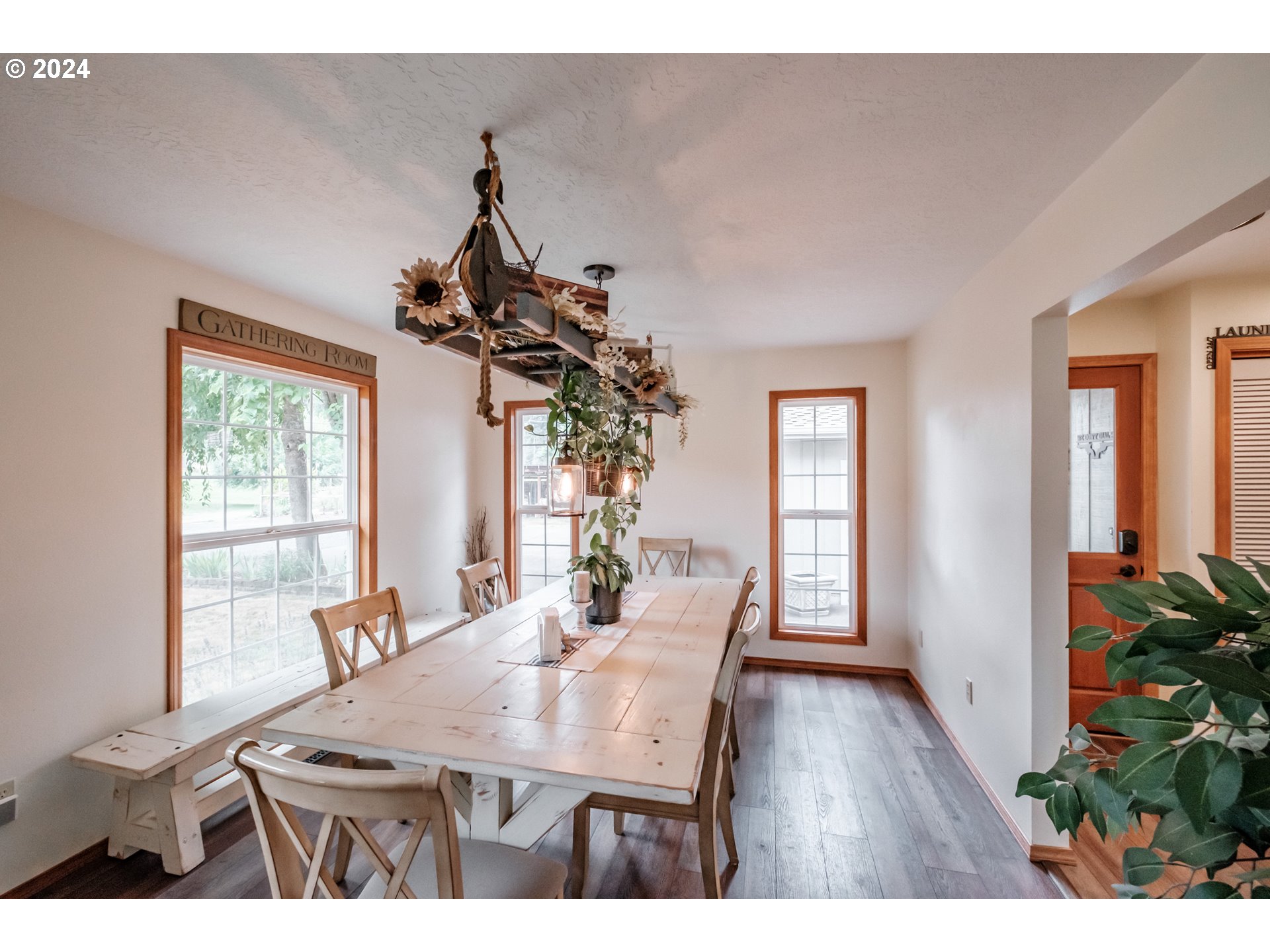 40166 Gates School Road Gates, OR 97346 - Photo 18 of 47 a view of a dining room with furniture window and wooden floor