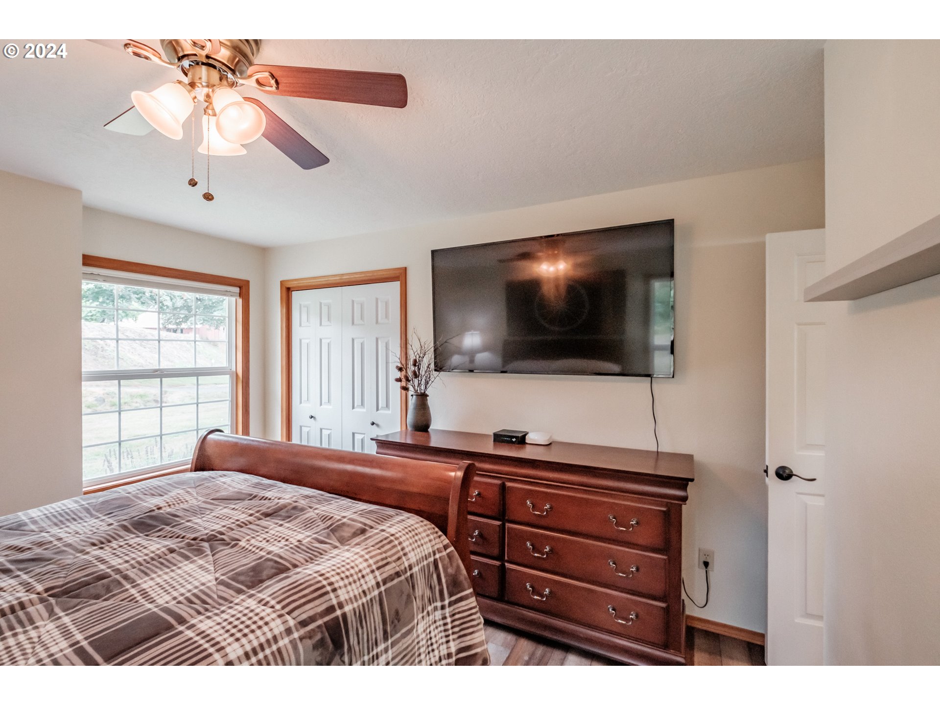 40166 Gates School Road Gates, OR 97346 - Photo 26 of 47 a bedroom with a bed and a flat screen tv