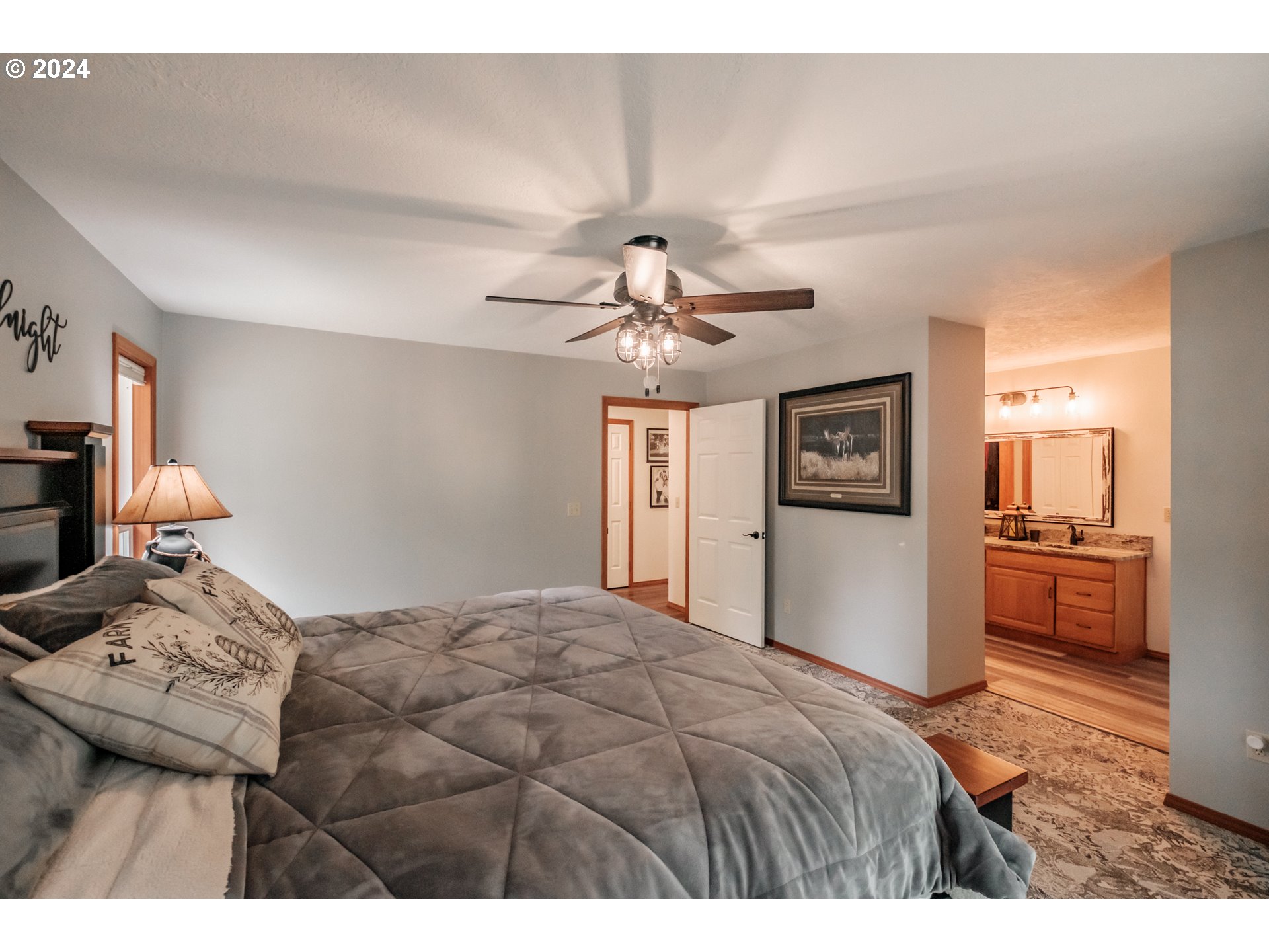 40166 Gates School Road Gates, OR 97346 - Photo 31 of 47 a bedroom with a bed and a chandelier