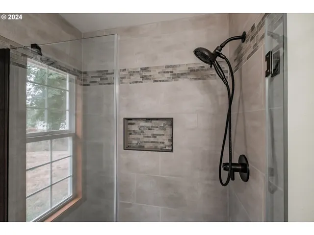 a view of a chairs and table in the balcony