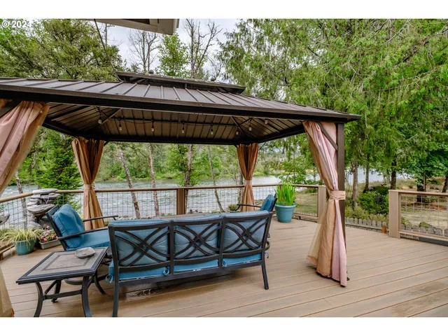 a backyard of a house with table and chairs
