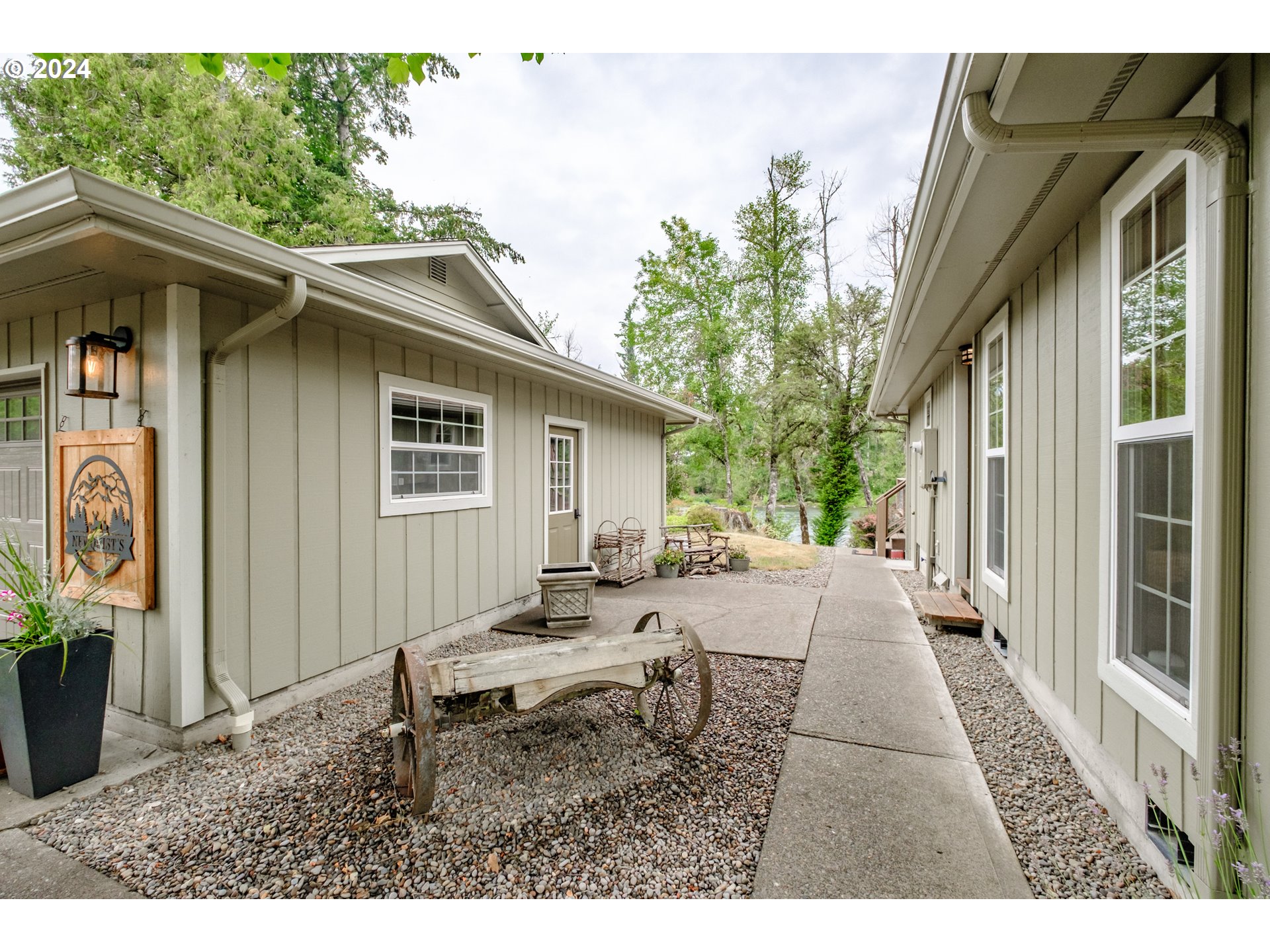 40166 Gates School Road Gates, OR 97346 - Photo 37 of 47 a backyard of a house with table and chairs