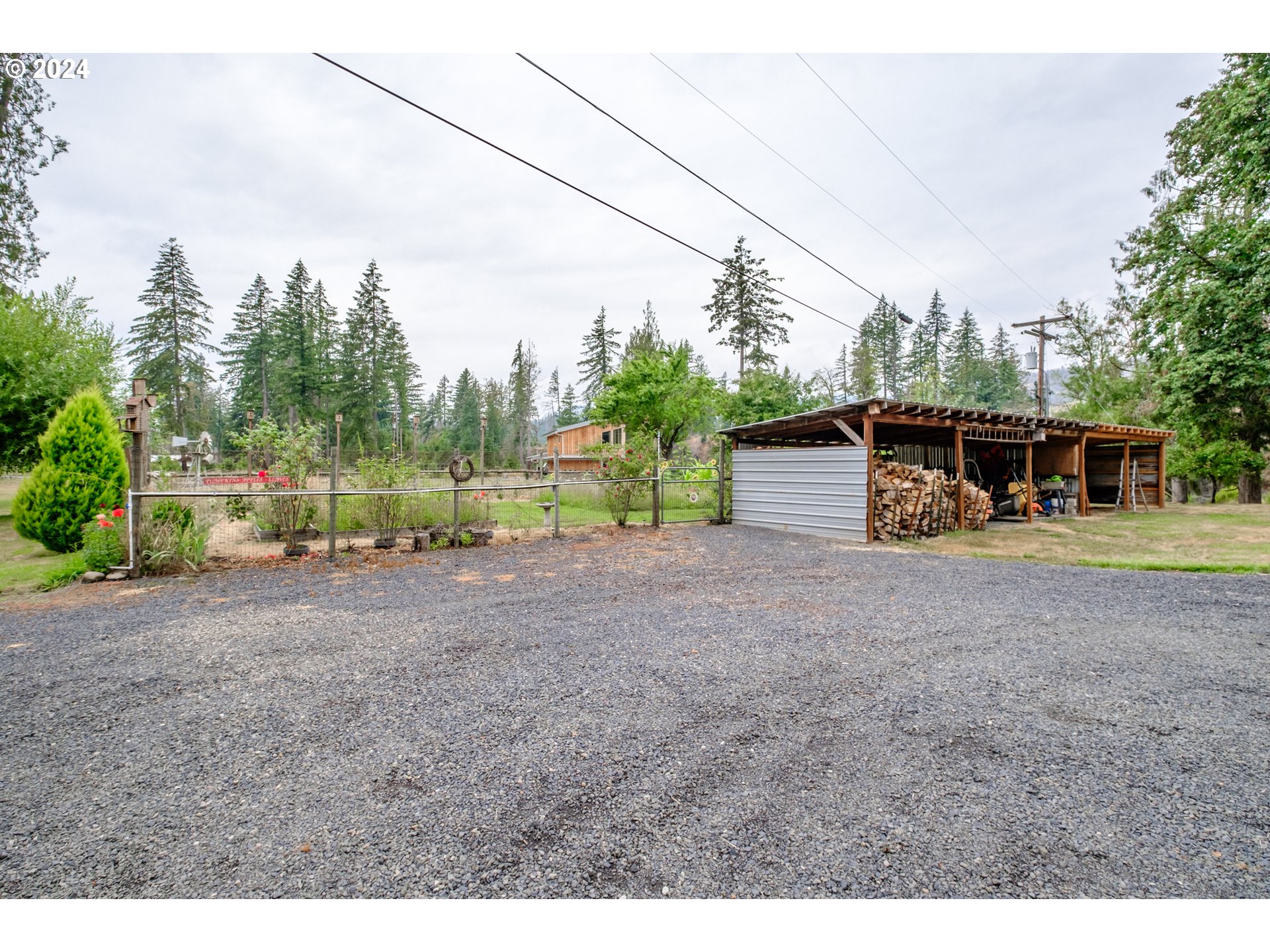 40166 Gates School Road Gates, OR 97346 - Photo 38 of 47 a view of a house with backyard and trees
