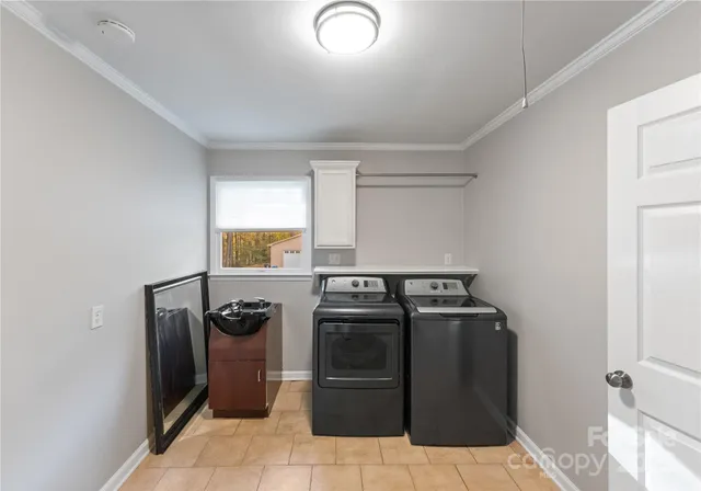 a utility room with washer and dryer