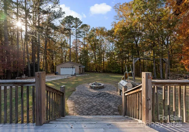 a view of a wooden deck and a yard