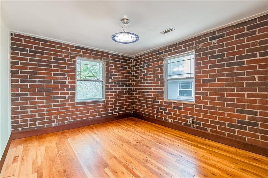 36 Daniel Street Southeast, Unit 5 Atlanta, GA 30312 - Photo 7 of 22 a view of a livingroom with an empty space and a window