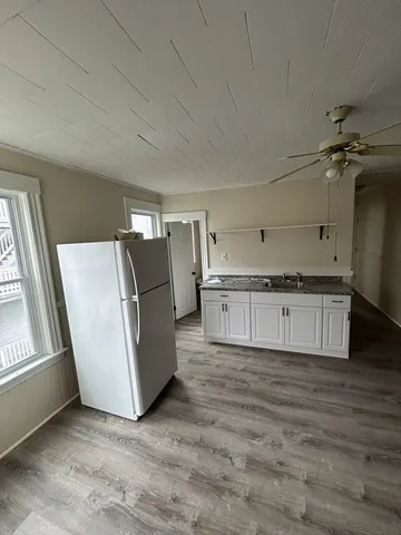 a large kitchen with a stove a refrigerator a sink and dishwasher