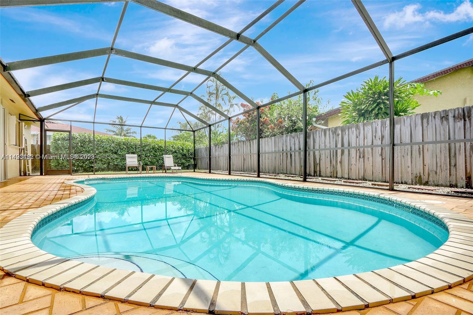 Palmetto Estates Miami, FL 33157 - Photo 11 of 26 a view of a backyard with a swimming pool