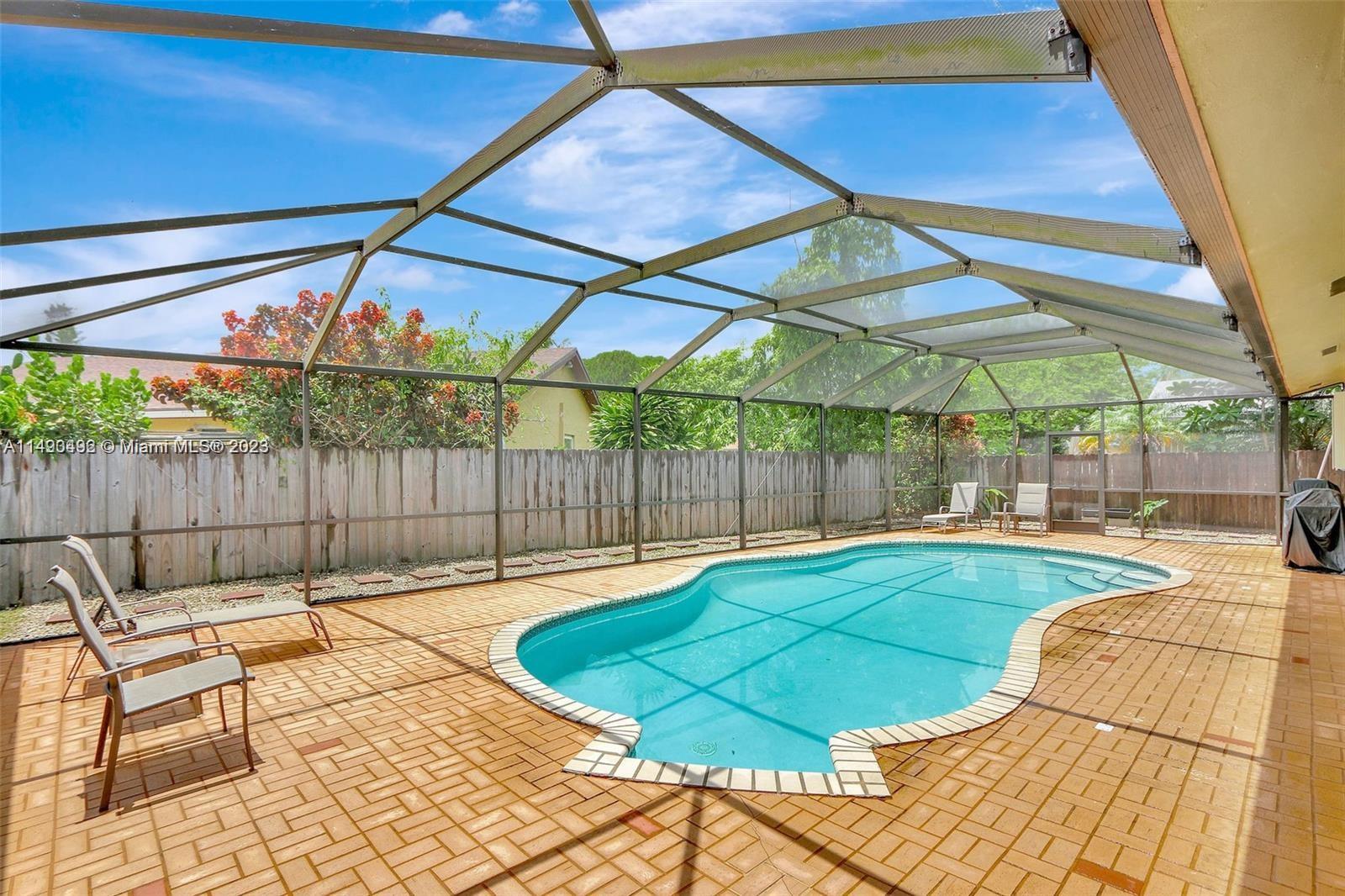 Palmetto Estates Miami, FL 33157 - Photo 13 of 26 a view of a backyard with a patio
