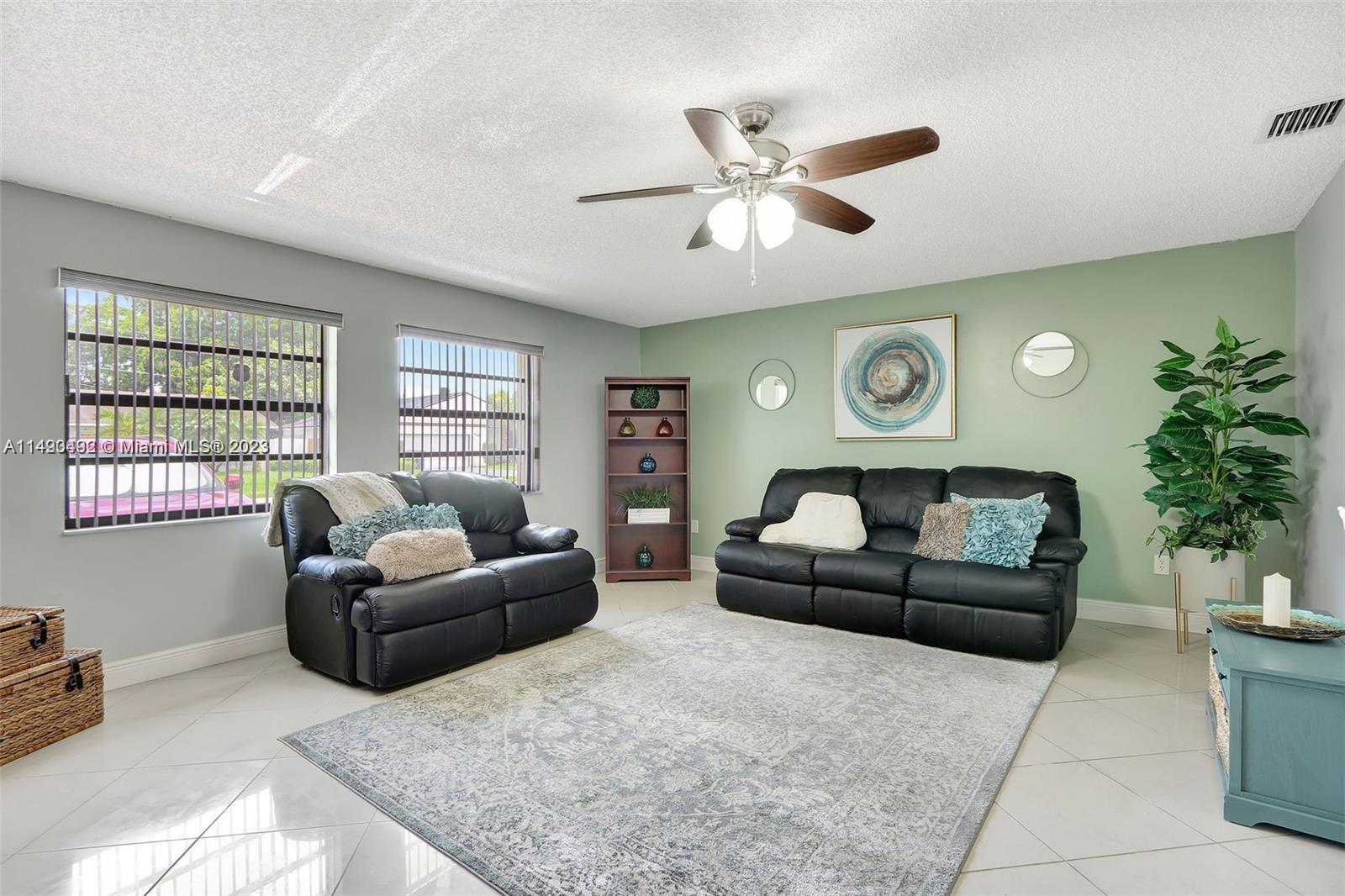 Palmetto Estates Miami, FL 33157 - Photo 14 of 26 a living room with furniture and a large window
