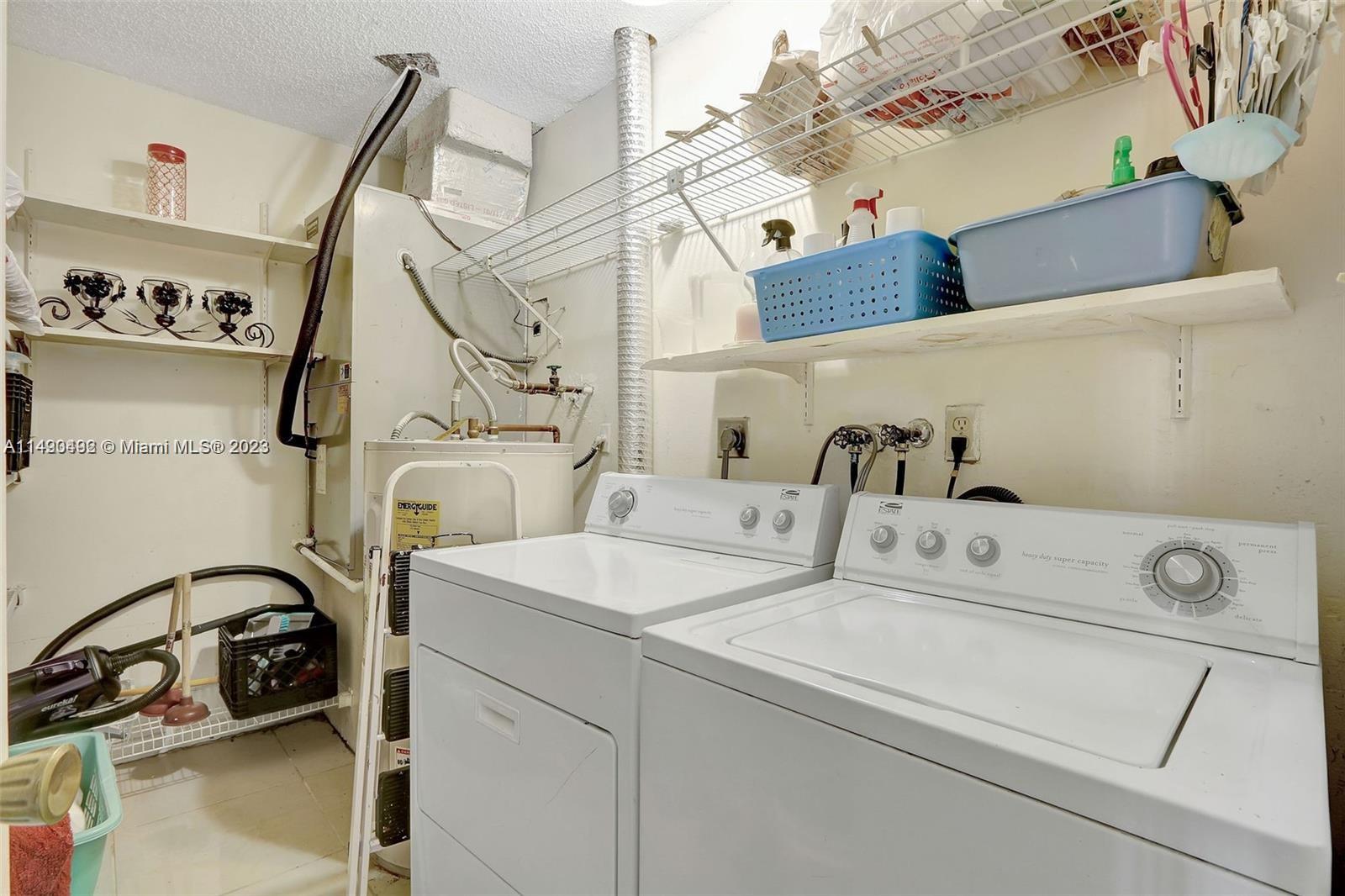 Palmetto Estates Miami, FL 33157 - Photo 16 of 26 a utility room with dryer and washer