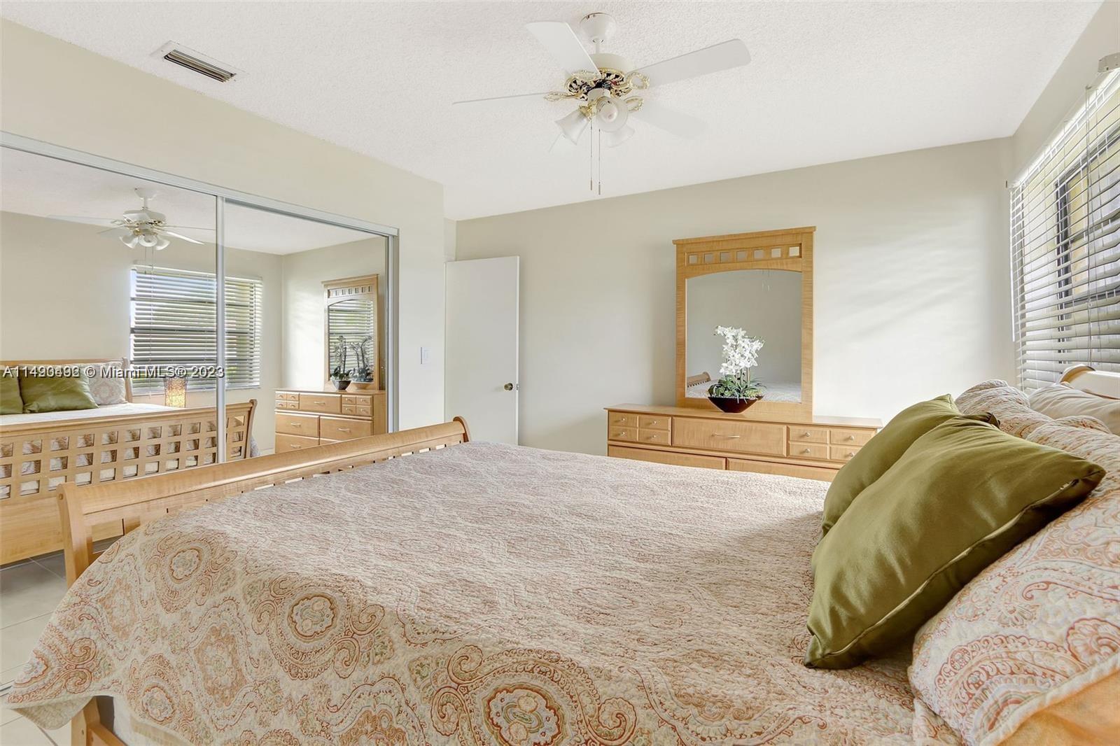 Palmetto Estates Miami, FL 33157 - Photo 23 of 26 a bedroom with a bed and window