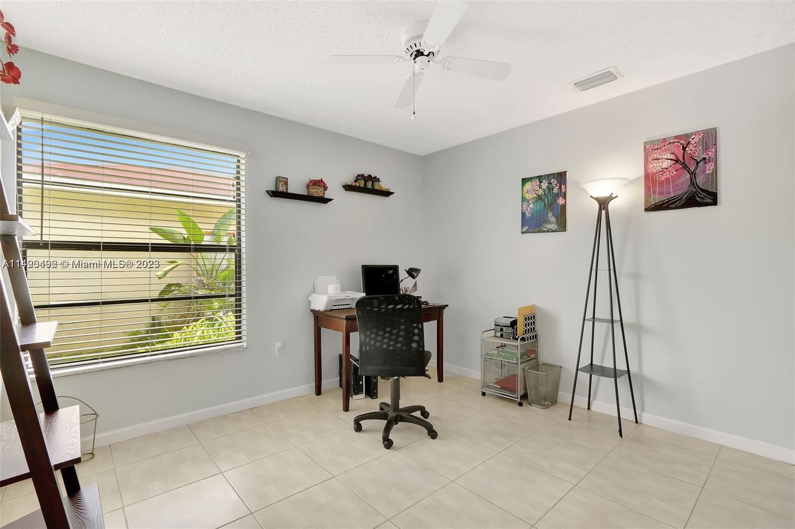 Palmetto Estates Miami, FL 33157 - Photo 25 of 26 a view of a workspace with furniture and a window