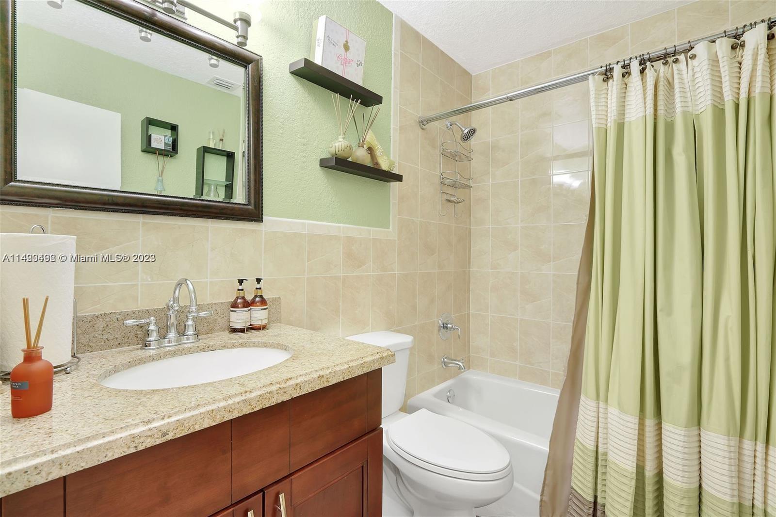 Palmetto Estates Miami, FL 33157 - Photo 26 of 26 a bathroom with a granite countertop sink toilet and shower