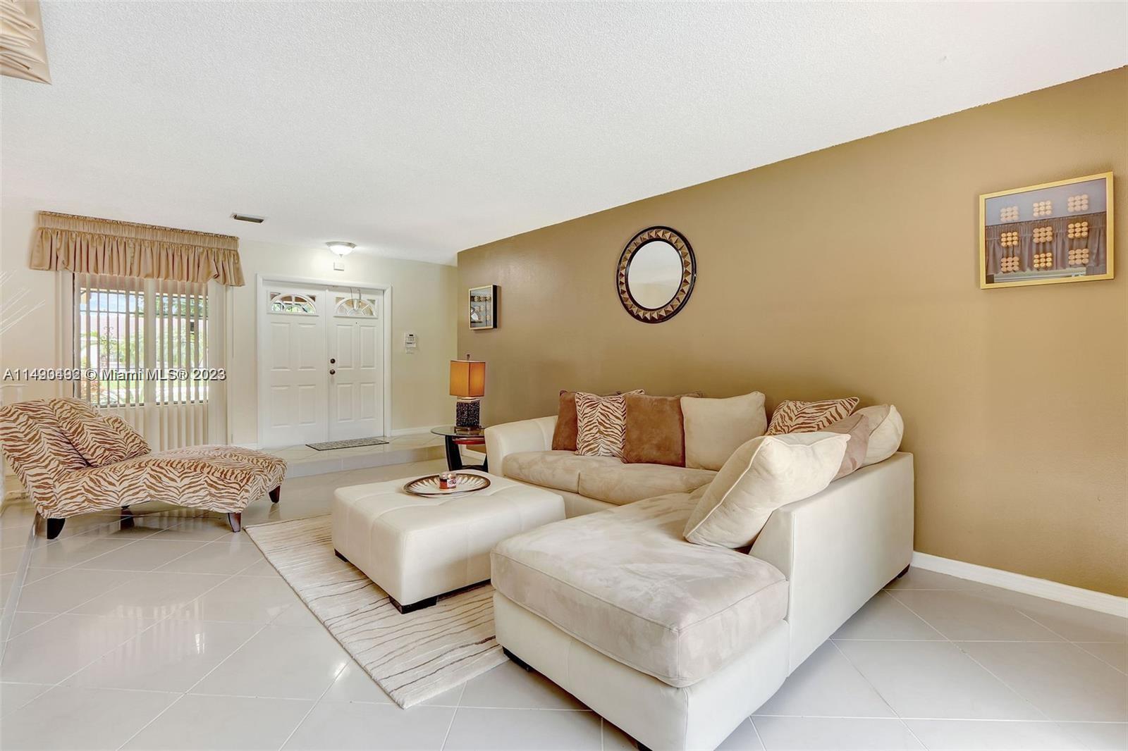 Palmetto Estates Miami, FL 33157 - Photo 3 of 26 a living room with furniture and a large window
