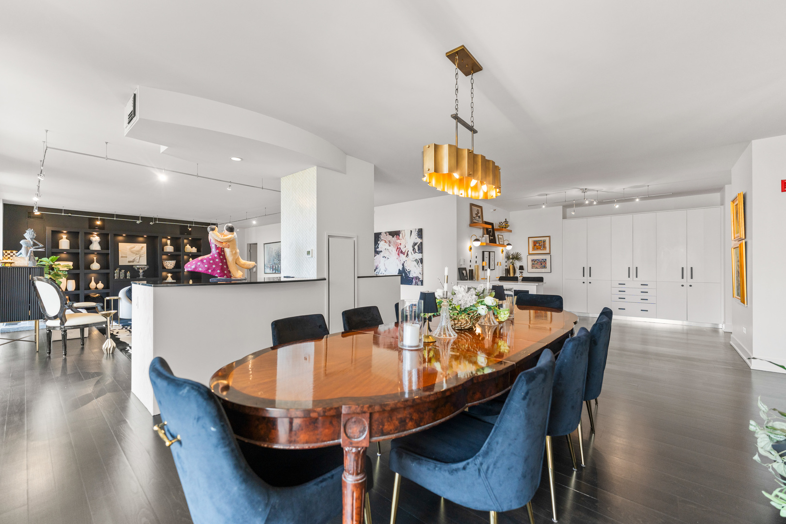 55 West Delaware Place, Unit 1011 Chicago, IL 60610 - Photo 15 of 50 a dining room with a table or chairs and a wooden floor
