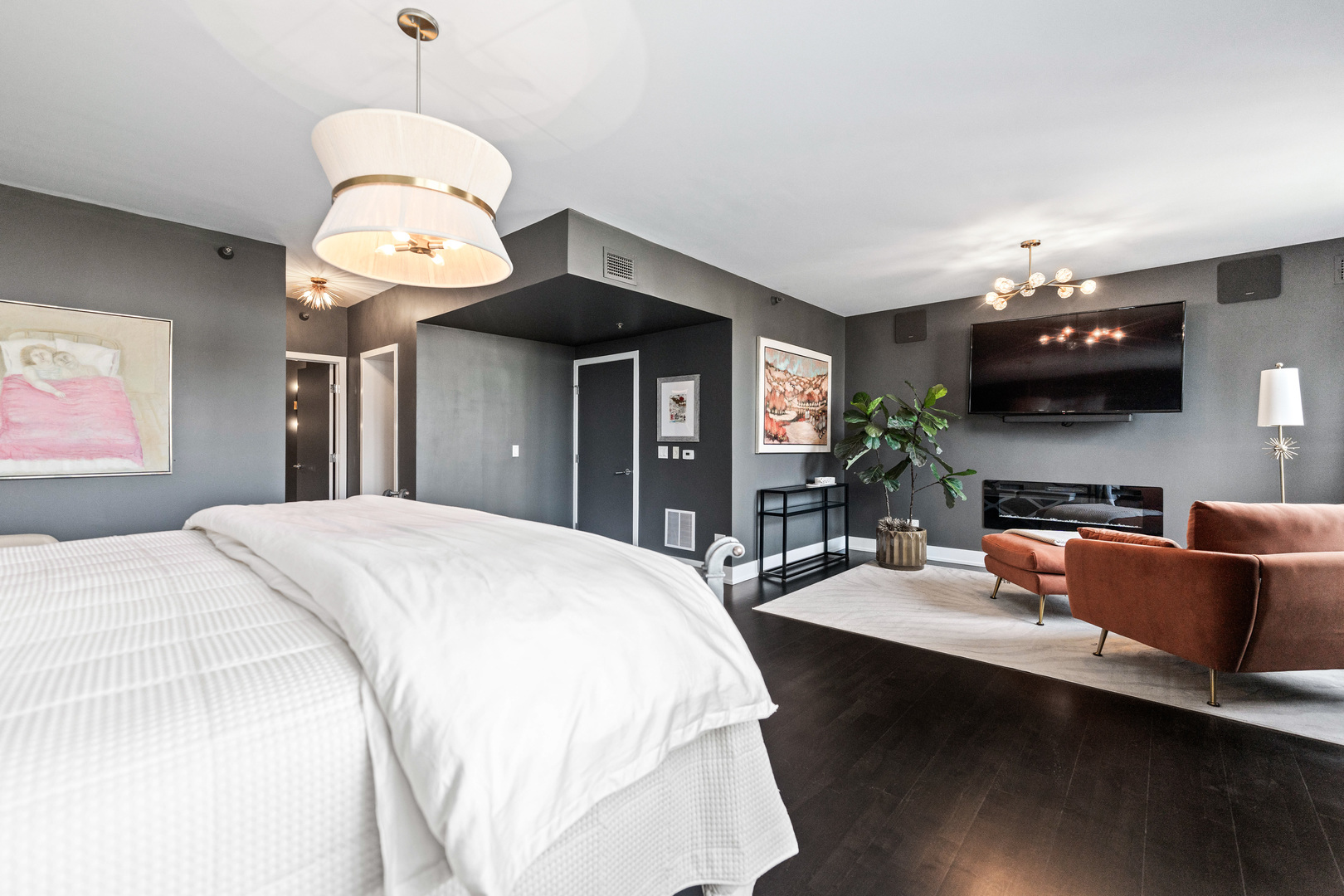 55 West Delaware Place, Unit 1011 Chicago, IL 60610 - Photo 27 of 50 a bed room with a bed and a chandelier