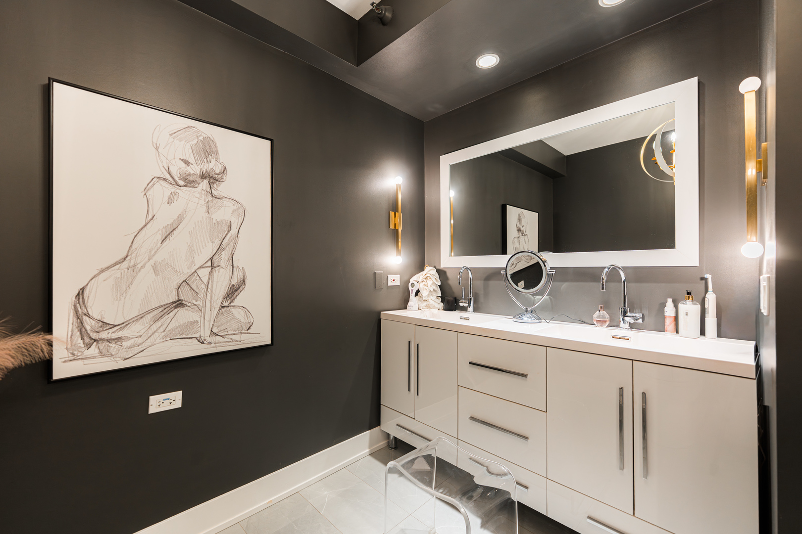 55 West Delaware Place, Unit 1011 Chicago, IL 60610 - Photo 32 of 50 a bathroom with a sink and a mirror