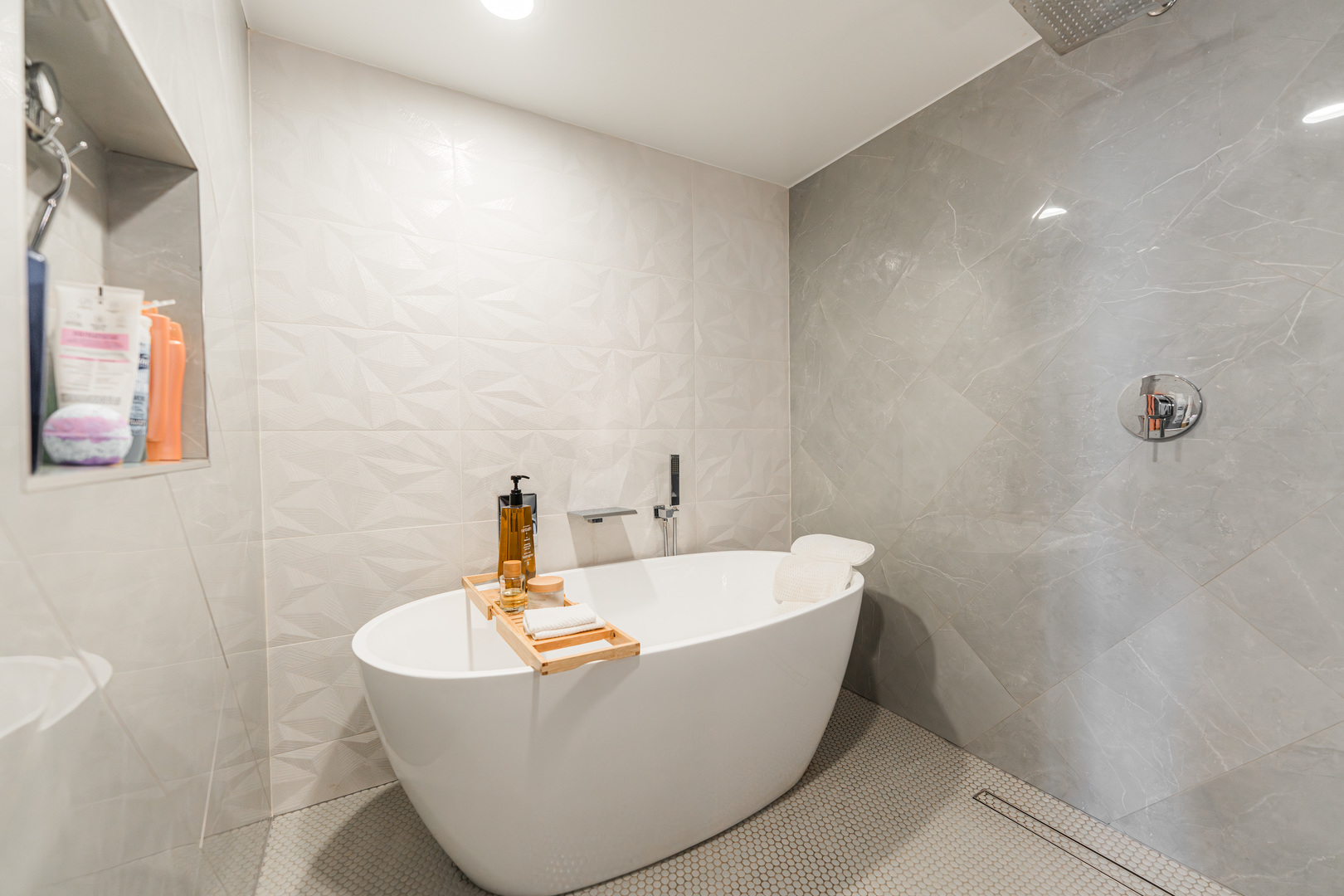 55 West Delaware Place, Unit 1011 Chicago, IL 60610 - Photo 33 of 50 a white bath tub sitting in a bathroom