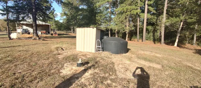 a table with chairs and wooden floor