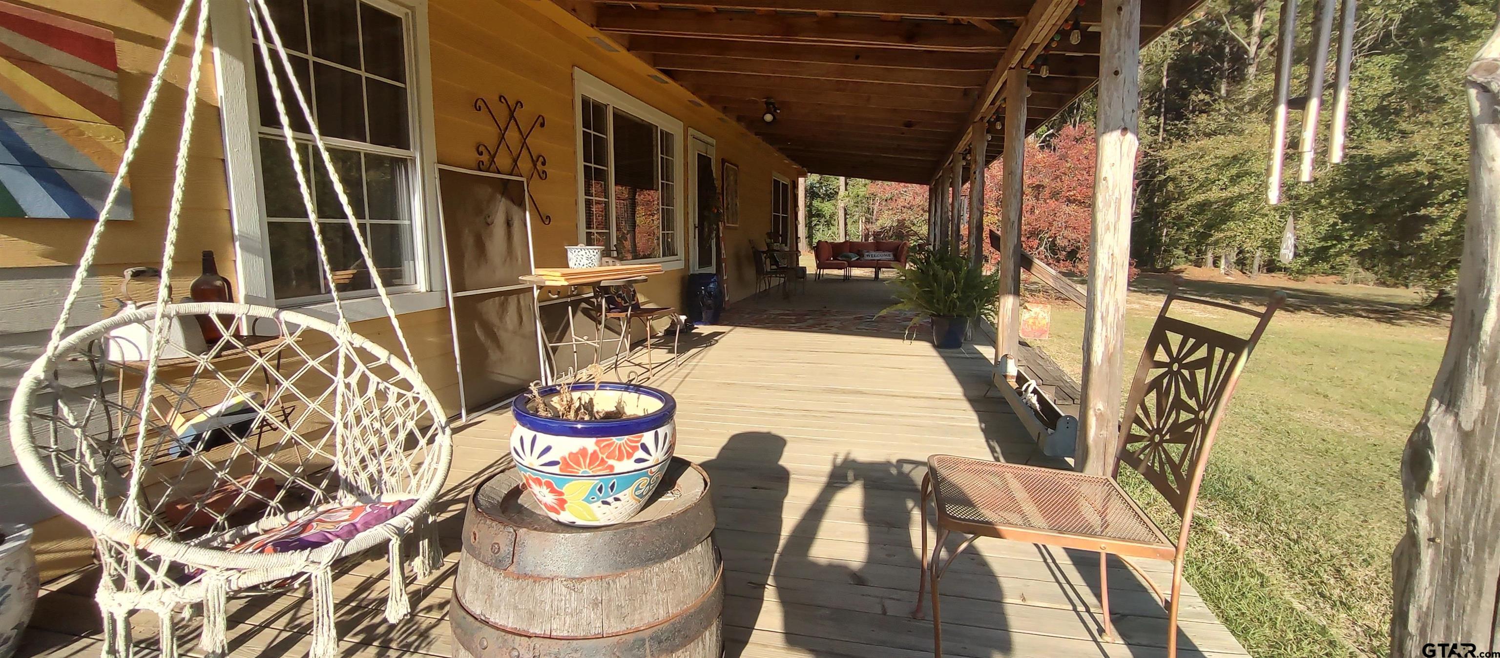 1271 County Road 3685 Joaquin, TX 75954 - Photo 28 of 46 a table with chairs and wooden floor