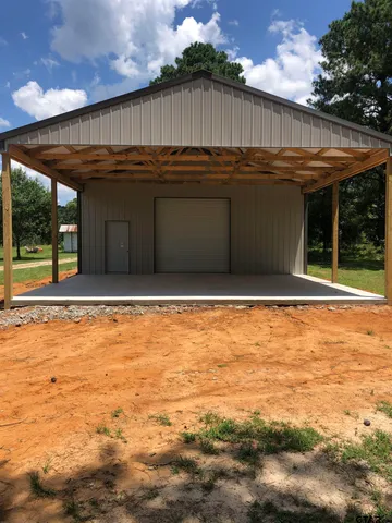 a view of a field with trees in the background