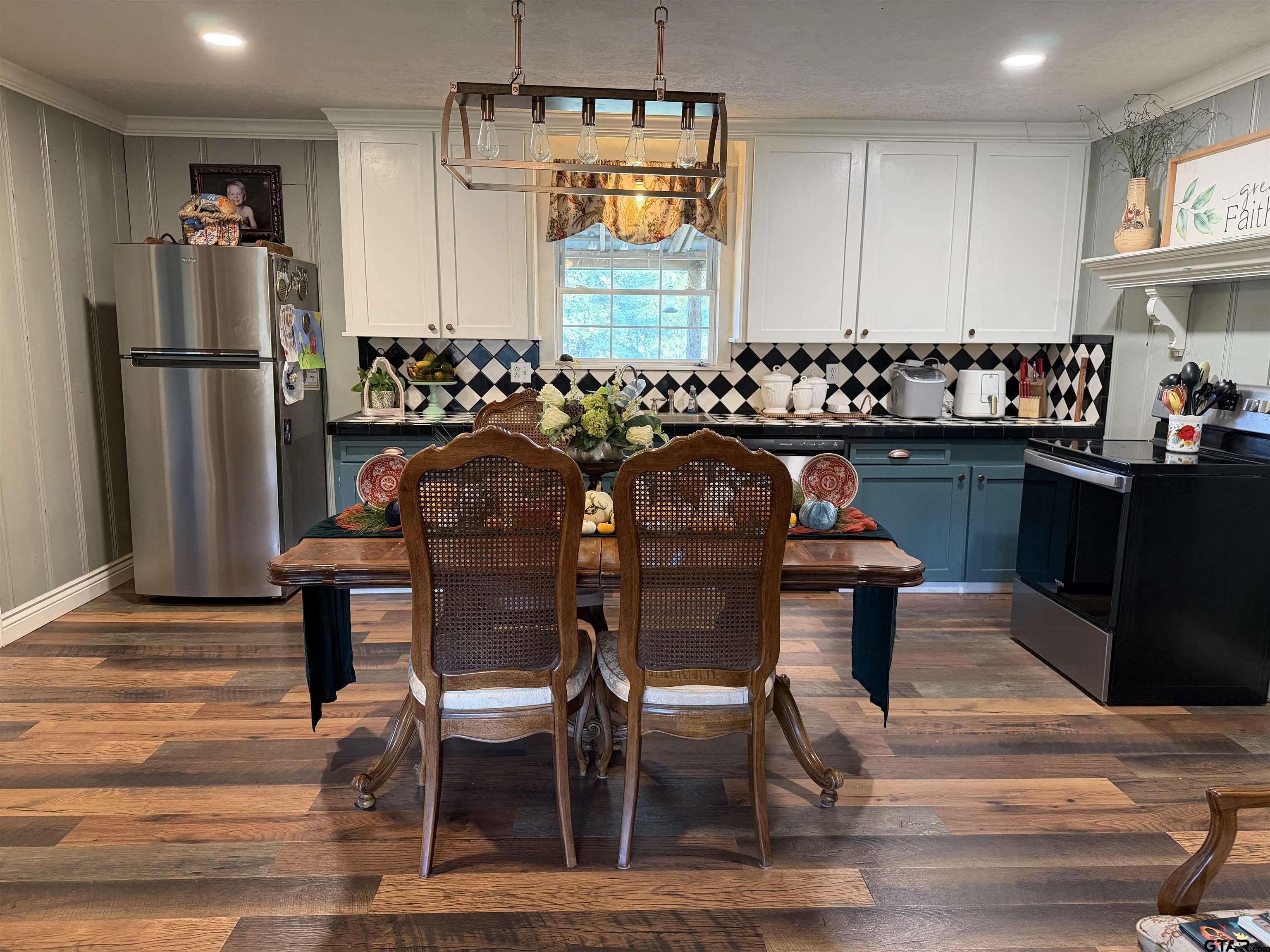 1271 County Road 3685 Joaquin, TX 75954 - Photo 37 of 46 a view of a dining room with furniture window and wooden floor