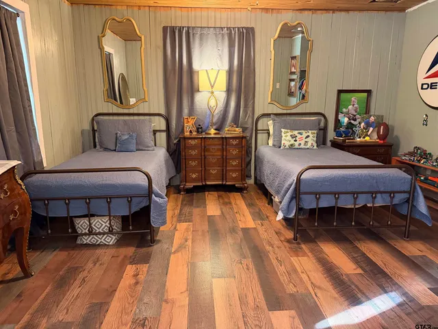 a dining room with furniture and wooden floor