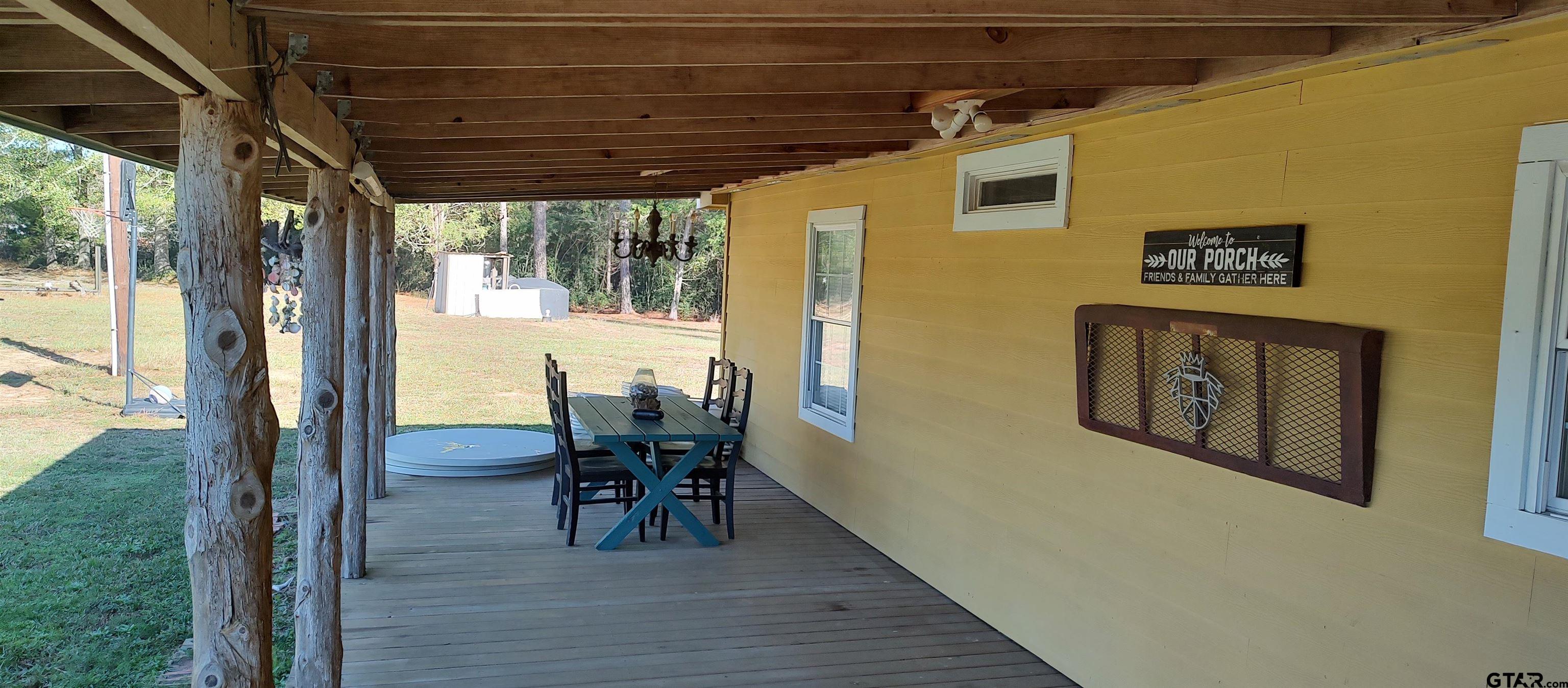 1271 County Road 3685 Joaquin, TX 75954 - Photo 39 of 46 a dining room with furniture and wooden floor