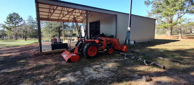a view of a yard with tree s