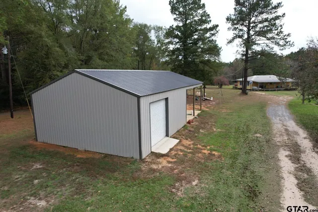 a view of a park with large trees