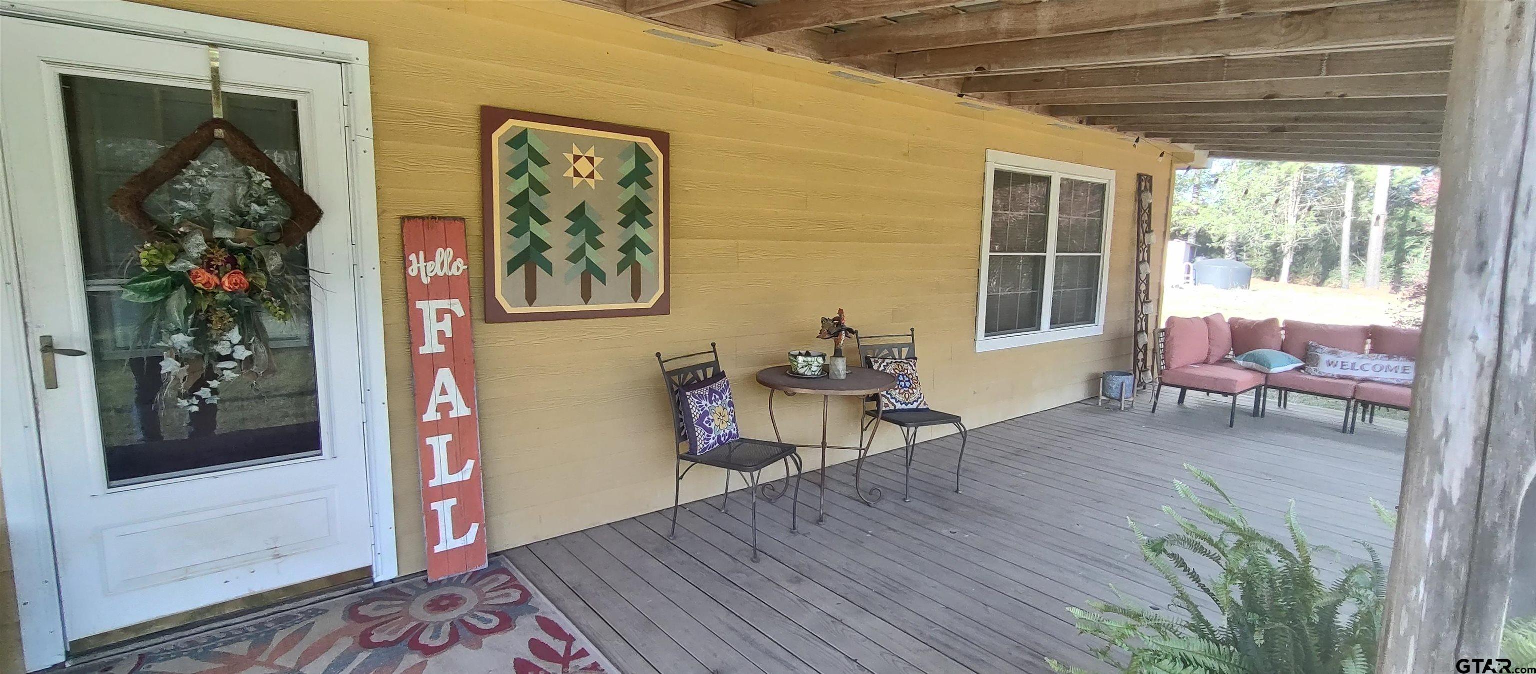 1271 County Road 3685 Joaquin, TX 75954 - Photo 8 of 46 a living room with furniture and a window
