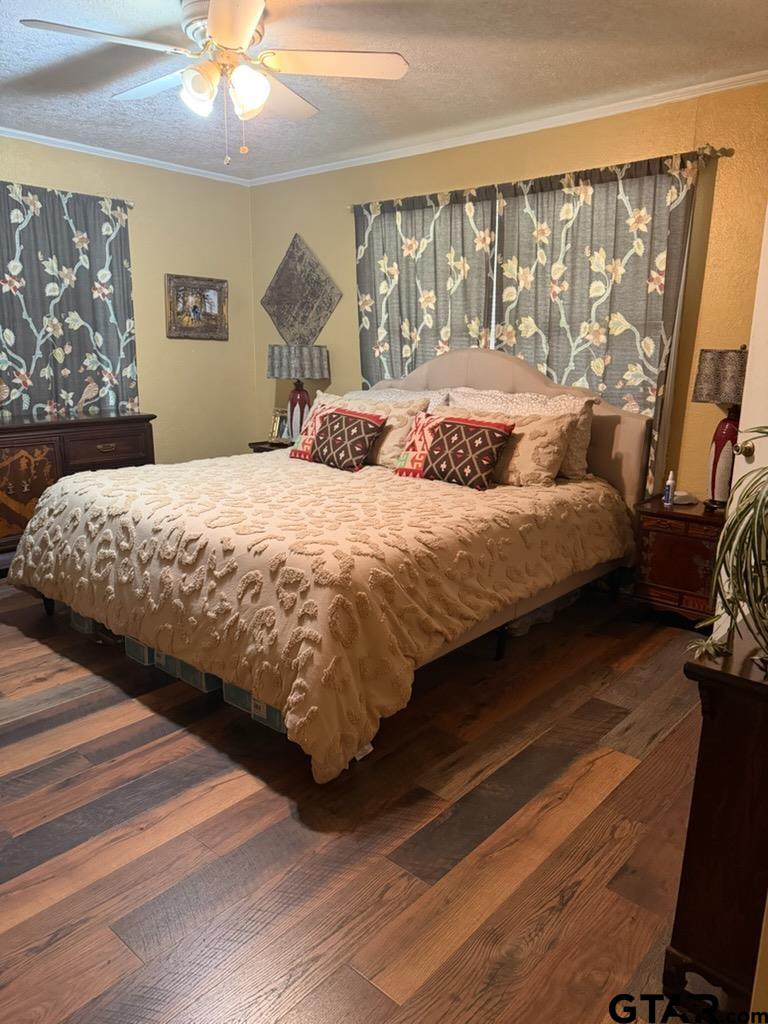 1271 County Road 3685 Joaquin, TX 75954 - Photo 10 of 46 a bedroom with a large bed and a large window
