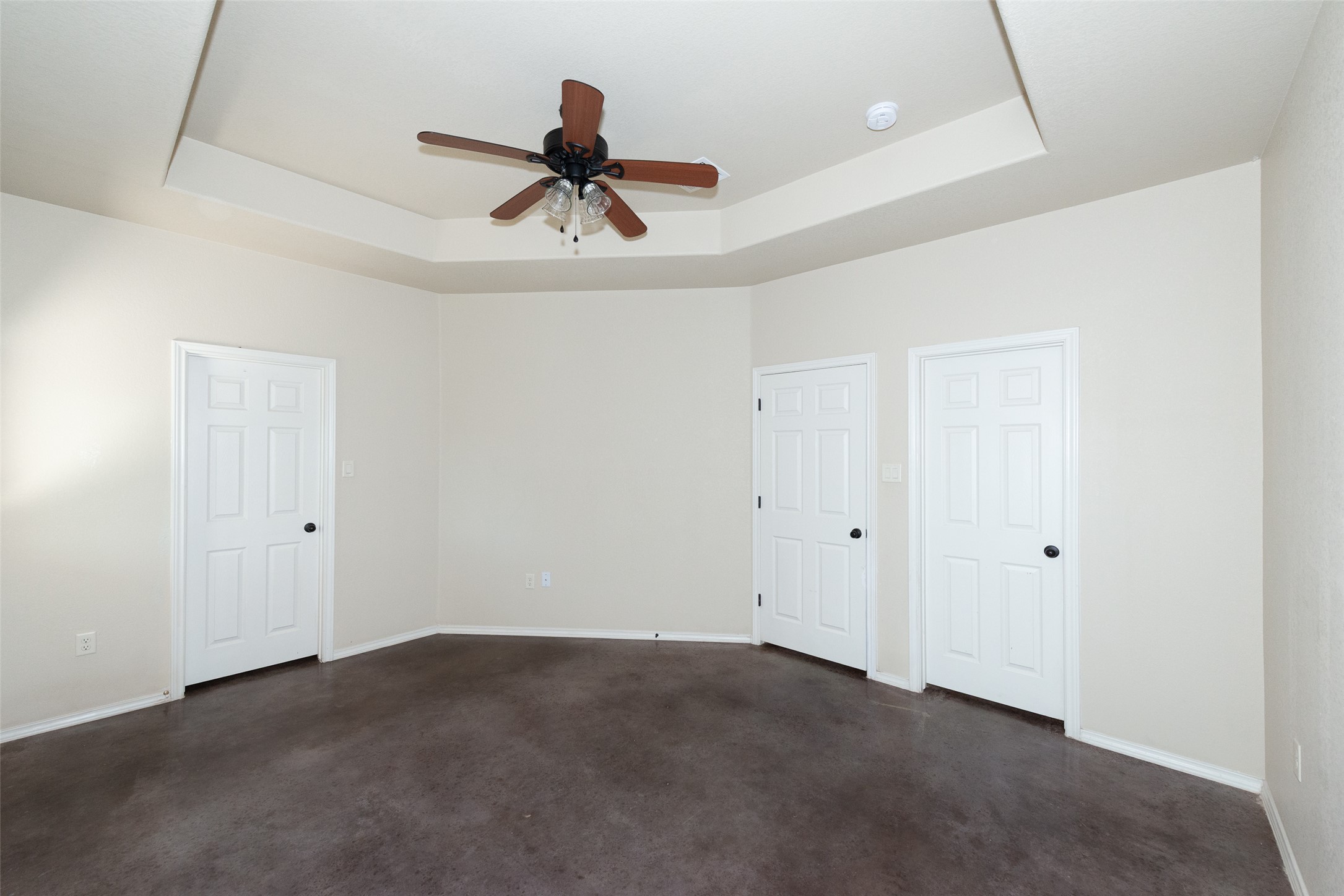 245 Joanne Loop, Unit B Buda, TX 78610 - Photo 22 of 33 Primary bedroom with ensuite full bathroom and walk in closet, ceiling fan, blinds.