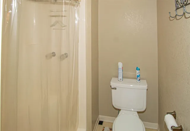 an empty room with a ceiling fan