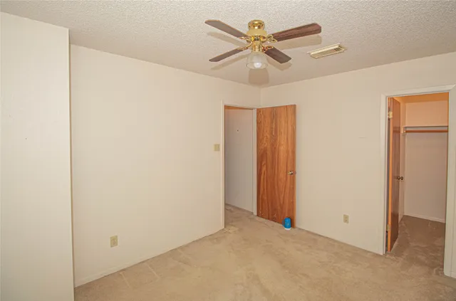 a view of a porch with chairs and backyard